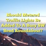 Should metered traffic lights be added to a busy SW Bend roundabout?