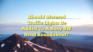 Should metered traffic lights be added to a busy SW Bend roundabout?